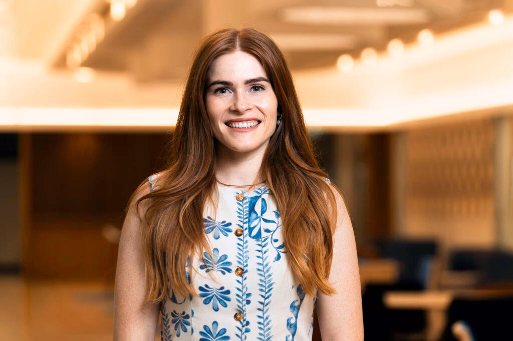 Renee Wootton Tomlin, proud Tharawal woman and CareerTrackers 2016 alumnus, smiling in an office setting.