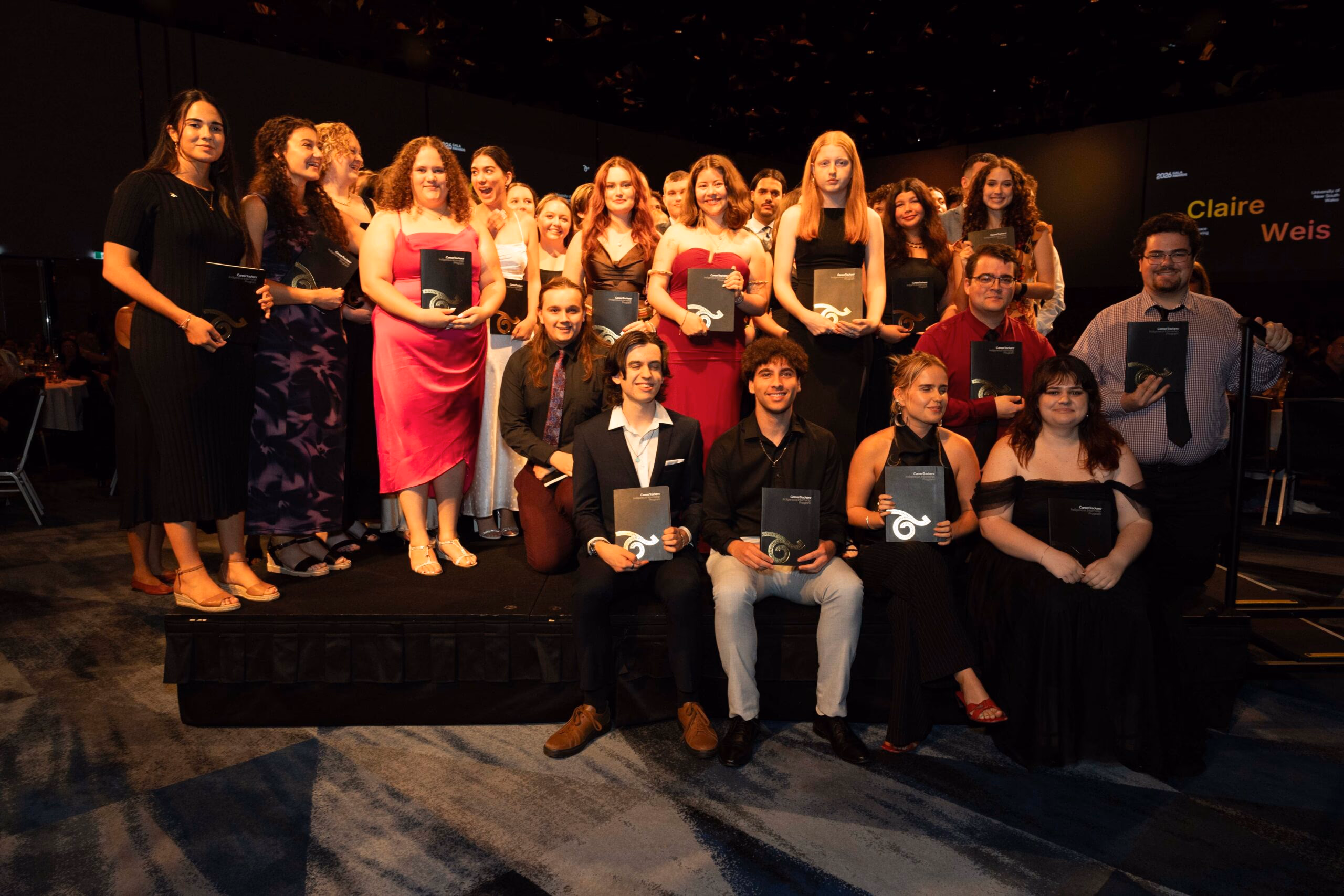 CareerTrackers interns and alumni posing together with their awards at the National Gala Awards.
